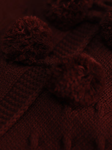 Casaco tricotado comprido pompons